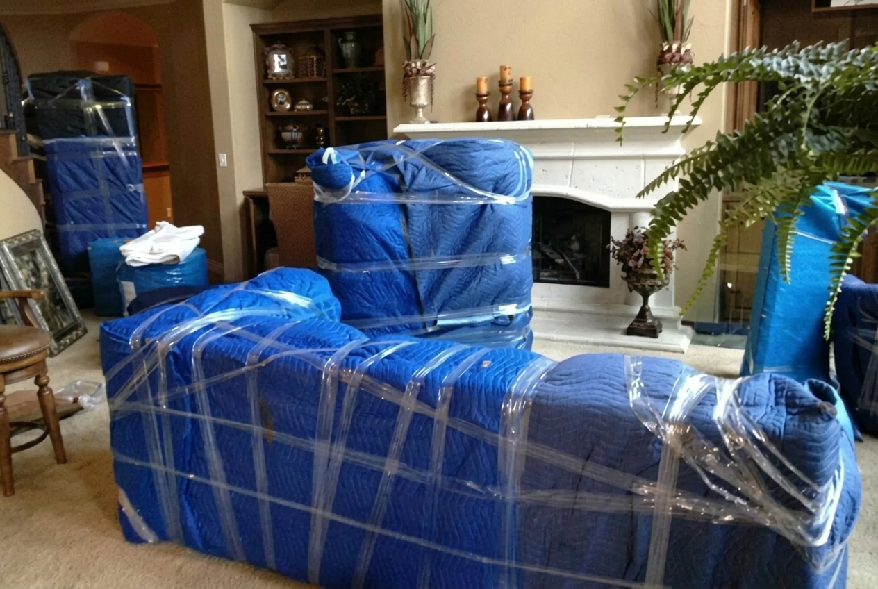 Gallery Tuzidi Movers wrapping chairs